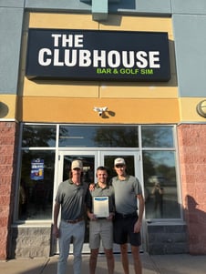 Zac Bell, left, and partners standing outside The Clubhouse SIM Golf & Bar
